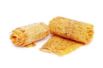 Dried and baked cuttlefish scroll on white background.