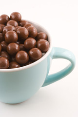 Blue cup of chocolates.
