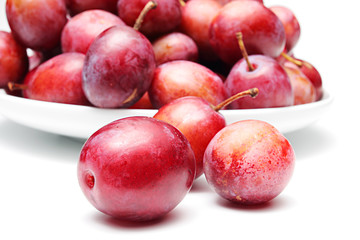 Plums on a white background