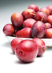 Plums on a white background