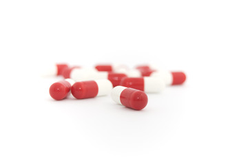 red and white capsules isolated on white background