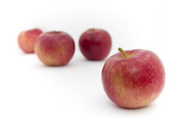 Fototapeta na wymiar four red and yellow apples on white background