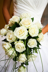 Close-up of white rose bouquet decorated with pearl beads