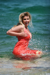 Glamorous blond girl in water