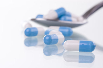 macro of pills on a spoon (selective and soft focus)