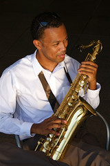 Fototapeta na wymiar An youung and trendy African-American sax musician