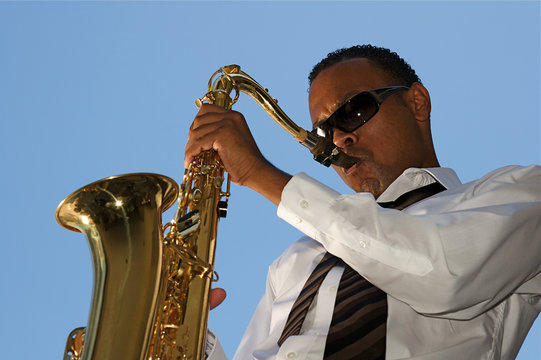 An youung and trendy African-American sax musician