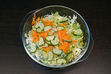Vegetable fresh mix salad on brown table