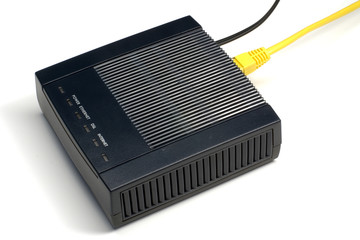 Black ADSL modem with connected LAN and phone wires