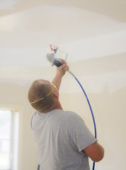 Contract painter updating colors of walls and painting ceilings
