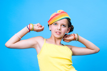 Beautiful young girl raising up her hands