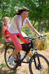 mother and daughter on bike