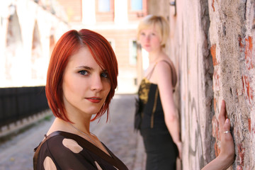 twi young girls near the old wall