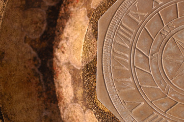 A horizontal sundial on a sandstone base