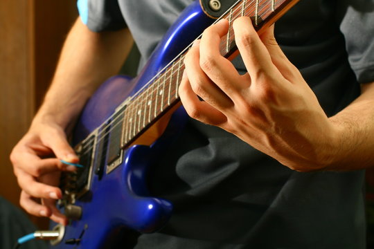 man play solo on blue guitar