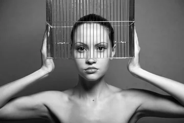 Foto op Aluminium Surrealistic portrait of young woman with cage © Egor Mayer