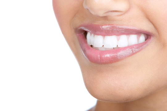 Beautiful young woman teeth. Isolated over  white background.