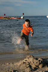 Child, water and fun. Beach fun.