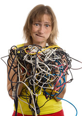 crazy woman with tangle of cables and wires in hands