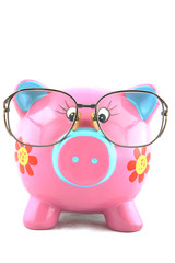 Piggy bank wearing glasses isolated over white