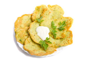 pancake from marrow with parsley on plate