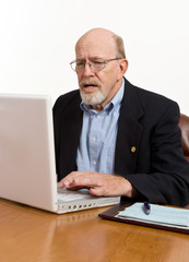 Senior Man Frustrated By His Computer