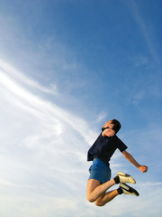 Young man  jumps highly on the sky