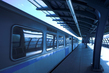 Fototapeta na wymiar Blue train at subway hall platform