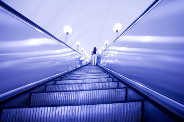 Violet move escalator in modern subway station