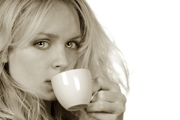 Beautiful sepia Image Of Woman Drinking Coffee
