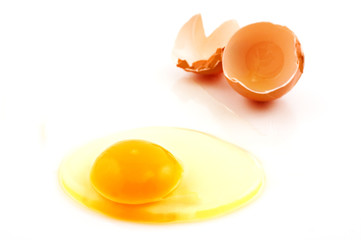 Broken egg on white background with copy space