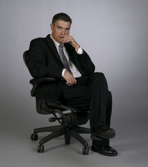 Professional Executive in Business Attire and Chair