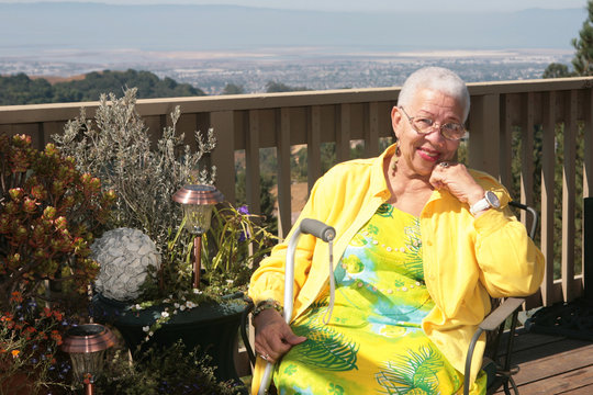 Happy African American Old Woman Smiling While Resting Outdoors