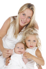 mother with her two daughters all dressed in white