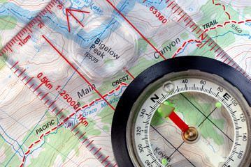 Transparent Navigational Compass on Topographical Map