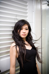 asian young women wind blowing her long black hair