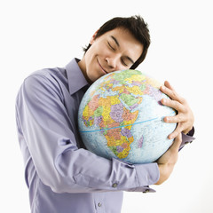 Man hugging globe