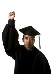Model in graduation robes and regalia with fist raised