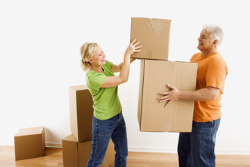 Man and woman moving boxes.