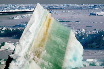 Ice floe with colorful layers