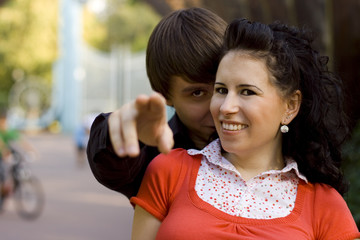 outdoor portrait of young happy attractive couple together