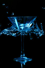 martini splash on black background close up