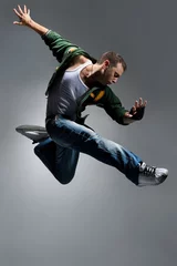 Foto op Canvas cool looking dancer makes a difficult jump © Alexander Y
