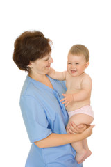 Doctor holding small smiling baby isolated on white