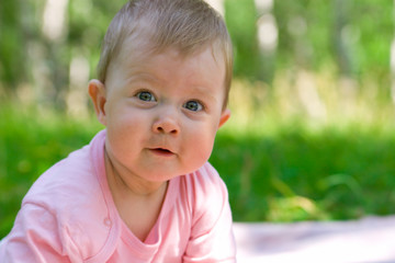 Small smiling baby in a wood #4