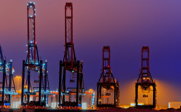 Large quay cranes at night