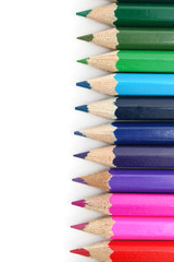 Obraz premium line of crayons on white background