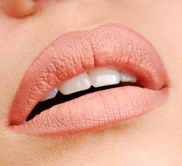 Woman lips with natural color of lipstick