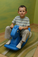 Child on rocking horse