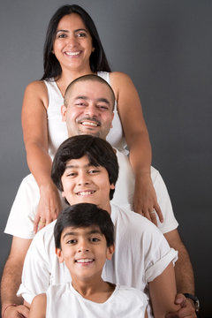 An Indian Family All Pose Together Ina  Fun Setting